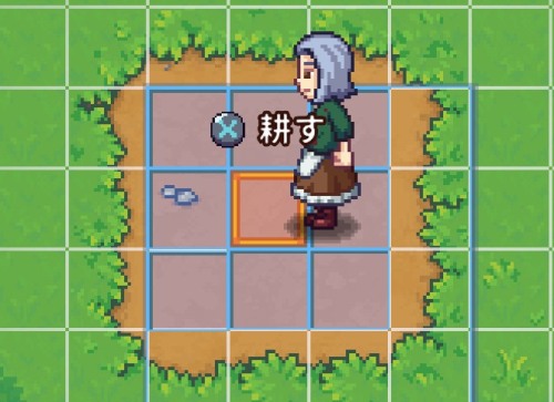 鍬(くわ)で畑を耕す